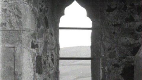 A shot through a window of the ruins of the monastery.