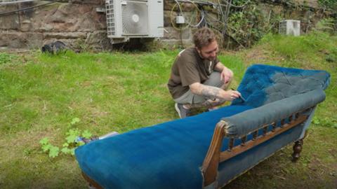 Man paints chaise lounge a darker shade of blue