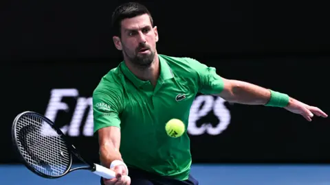 Novak Djokovic hits a forehand