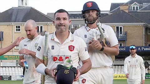 Essex players leave the field