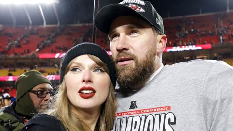 Taylor Swift and Travis Kelce of the Kansas City Chiefs embrace at Arrowhead Stadium on January 26, 2025 in Kansas City, Missouri.