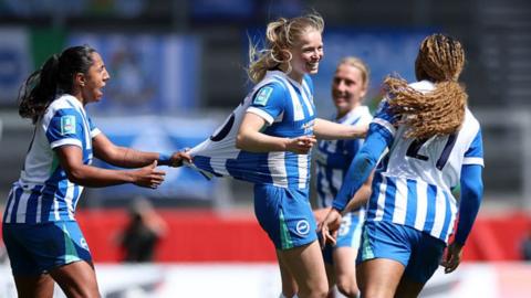 A smiling Nadine Noordam celebrates with Brighton team-mates
