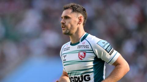 Tomos Williams standing on the pitch during a match for Gloucester