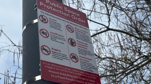 A sign detailing the public space protection order. It includes no alcohol, begging, charity collections and scooters and bikes. 