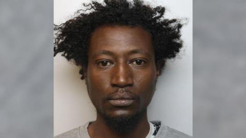 A mugshot of 35-year-old Abdul Hamed, who is wearing a light grey jumper.