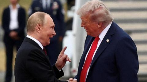 U.S. President Donald Trump shakes hand with Russian President Vladimir Putin, as they meet to negotiate for an end to the war in Ukraine, at Joint Base Elmendorf-Richardson in Anchorage, Alaska,