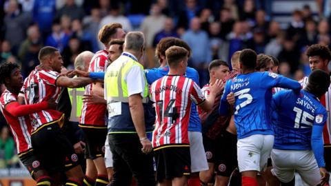 Sheffield United and Portsmouth players arguing and shoving following their 0-0 draw