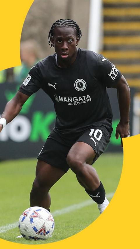 Abdul Abdulmalik dribbles football