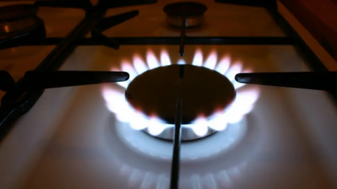 A close up of a lit gas hob