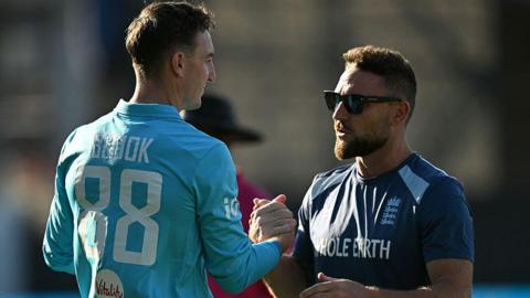 Harry Brook shakes hands with Brendon McCullum