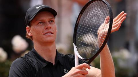 Jannik Sinner applauds the crowd after reaching the Italian Open semi-finals