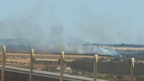 Smoke on fields seen from a distance