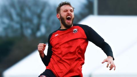 Tom Harrison celebrates scoring