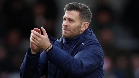 Luke Garrard applauds Boreham Wood supporters