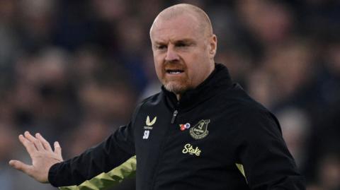 Dyche waves his arm on the touchline