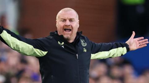 Sean Dyche with arms outstretched 