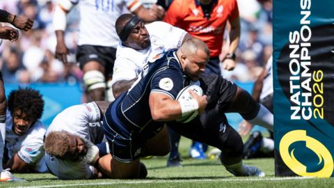 Scotland's Pierre Schoeman scores a try