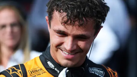 McLaren's Lando Norris smiles after taking pole position for the Hungarian Grand Prix