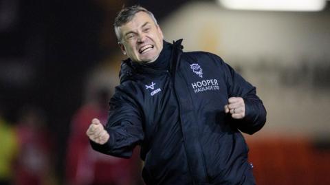Lincoln City boss Michael Skubala celebrates victory against Doncaster