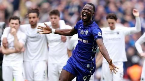 Mani Dieseruvwe of Rochdale celebrates victory after a penalty shootout