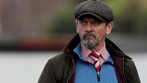 Kidderminster boss Phil Brown looks on from the touchline