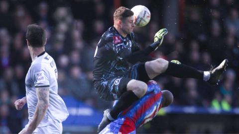 Millwall's Liam Roberts fouls Crystal Palace's Jean-Philippe Mateta which resulted in him receiving a recd card