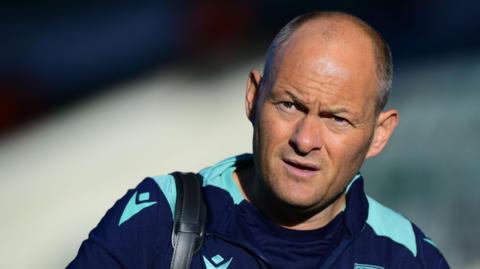 Alex Neil looks on during his time in charge of Stoke City