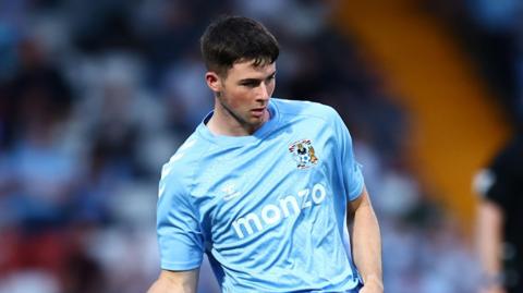 Ryan Howley kicking the ball during a pre-season match for Coventry in 2024