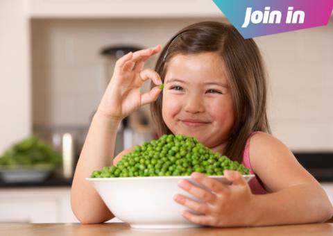 Girl with a bowl full of peas