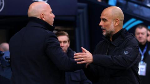 Liverpool manager Arne Slot greets Manchester City boss Pep Guardiola before their FA Cup quarter-final