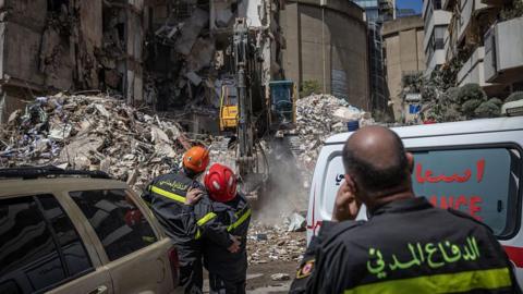 Emergency services look at a destroyed building on April 09, 2026 in Beirut, Lebanon