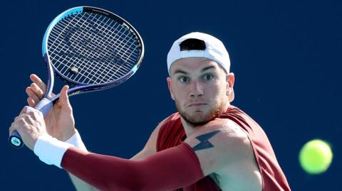 Jack Draper playing a backhand