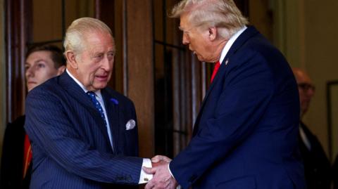 King Charles and President Trump shaking hands