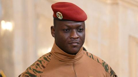 Burkina Faso's military leader Ibrahim Traore in military uniform and a red beret