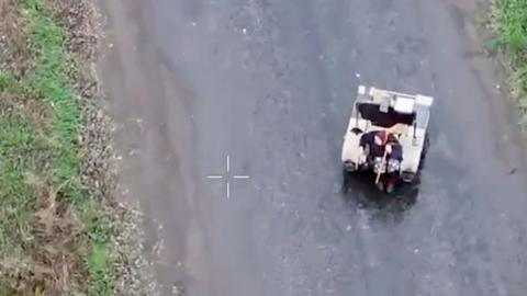Robot seen carrying elderly woman in Ukraine