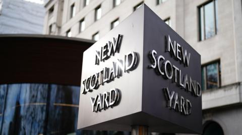 close-up of the New Scotland Yard sign in front of the headquarters of the Metropolitan Police - also known as Scotland Yard.
