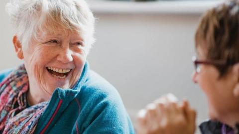 Two women laughing