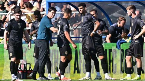 Andoni Iraola talks to his Bournemouth players on the touchline during the friendly against Wrexham