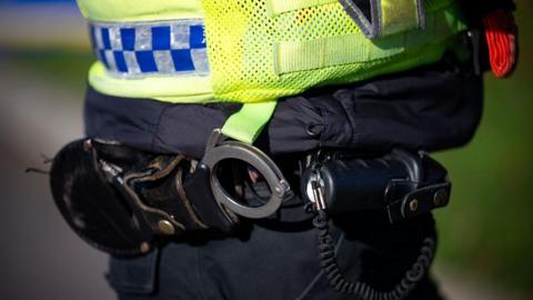 A stock image of a police officer's handcuffs.