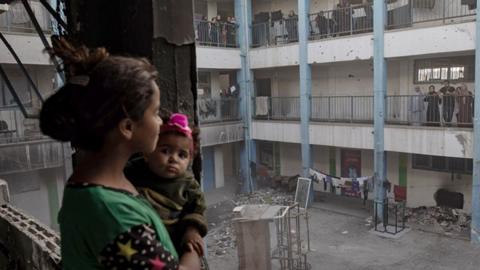 Children in a destroyed school in Khan Younis after leaving Rafah