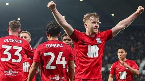 ommy Doyle (far right) stands with his arms aloft celebrating Birmingham City's equaliser against West Bromwich Albion with team-mates