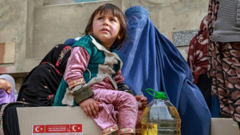 A child at a food distribution centre