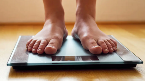 a person standing on scales