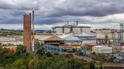 Liberty Steel's plant in Rotherham consists of a number of large industrial buildings with tall chimneys on the left