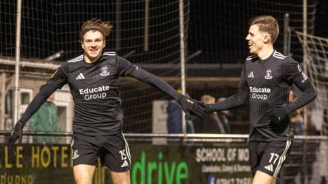 Connah's Quay Nomads' Harry Franklin celebrates opening the scoring at Caernarfon