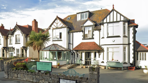 Double fronted Orme View care home, Llandudno, painted black and white