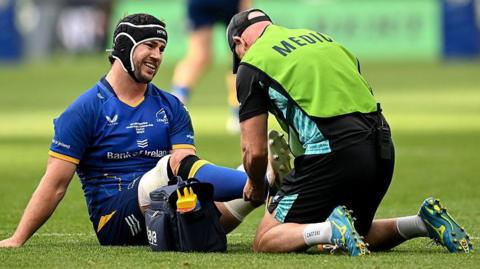 Caelan Doris receives treatment on the pitch
