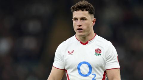 Henry Arundell standing on the pitch in an England shirt during the match against Fiji