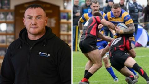 Ross is wearing a dark hoody and standing in the middle of a rugby club, facing the camera.