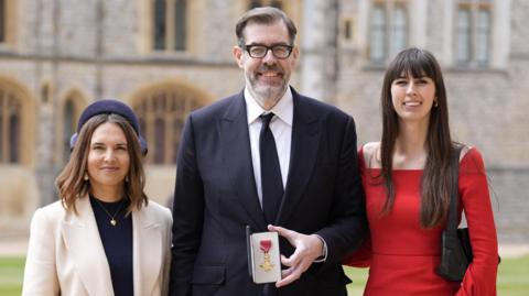 Richard Osman, his partner Ingrid Oliver and daughter Ruby Osman after he was made an OBE (Officer of the Order of the British Empire) at an investiture ceremony at Windsor Castle, Berkshire, Britain, May 5, 2026